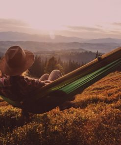 male enjoying mellow in the sunset after having WYLD Sour Cherry Gummies