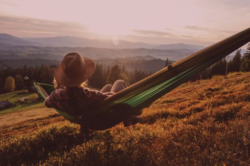 male enjoying mellow in the sunset after having WYLD Sour Cherry Gummies