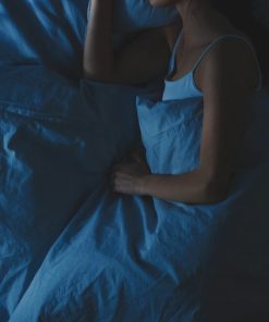female sleeping after having WYLD Elderberry Gummies