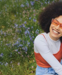 a lady having a blissful moment after having WYLD Blood Orange Gummies