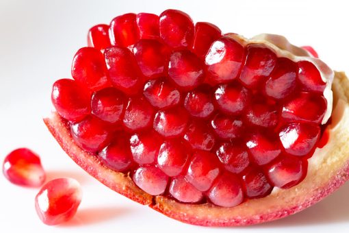Fresh pomegranate fruits used in the production of WYLD Pomegranate Gummies